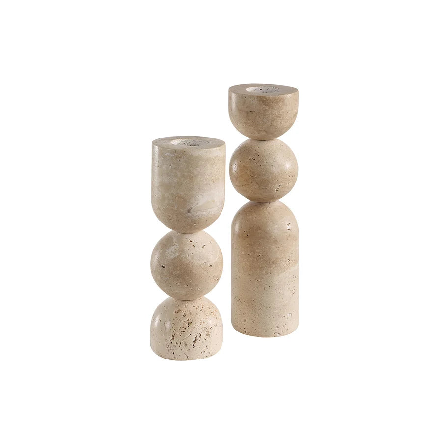 Stack of beige stone candle holders on a white background