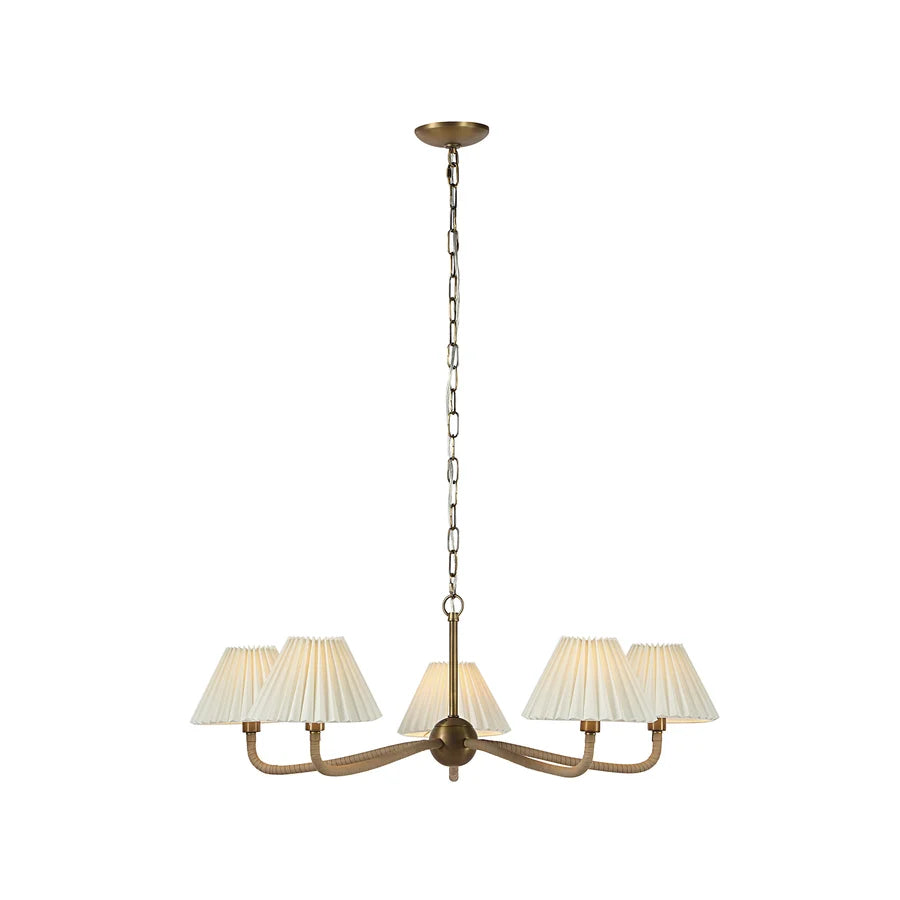 A five-light chandelier with a warm brass-finished metal frame, pleated off-white fabric shades, and a hanging chain, shown against a plain white background.